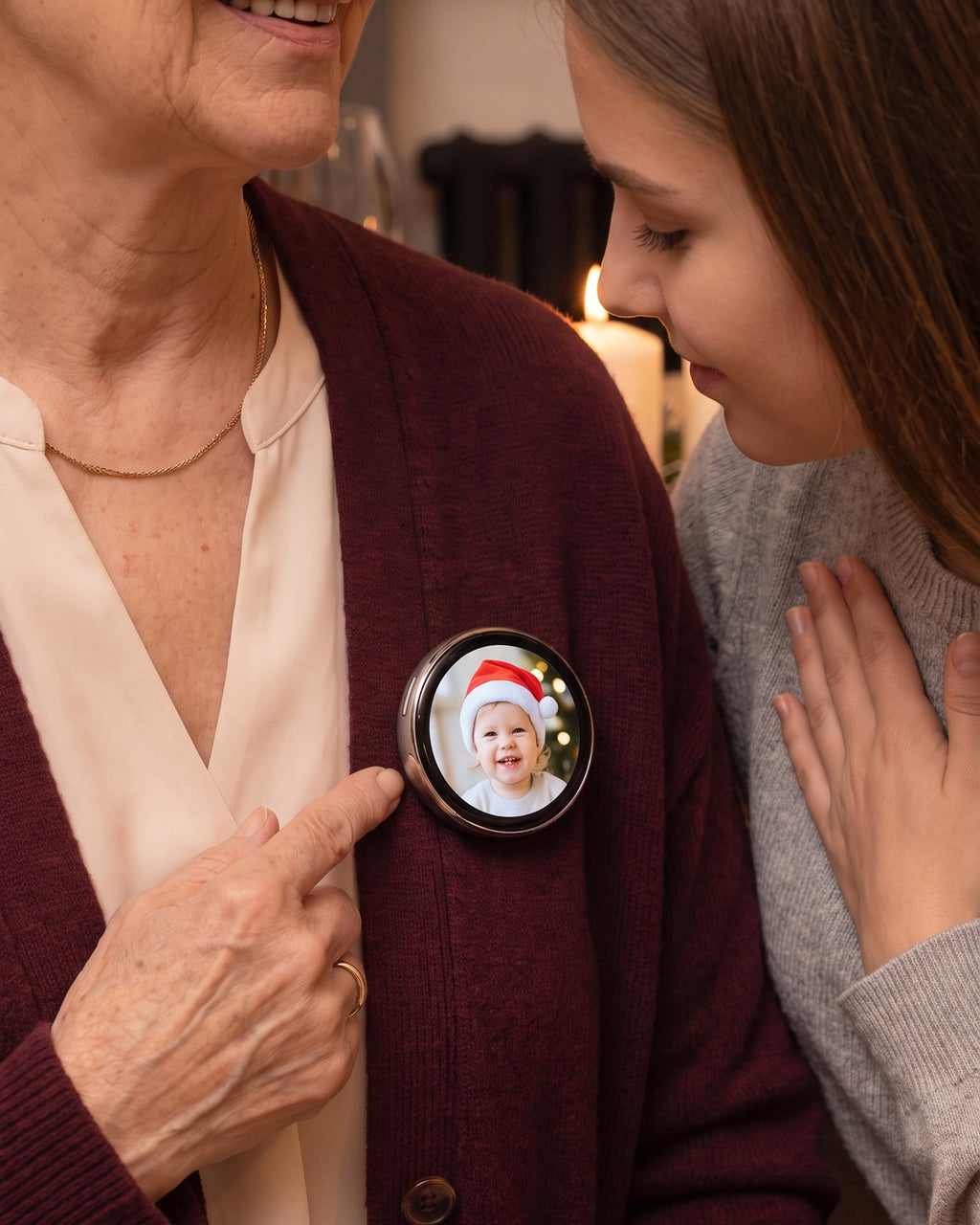 Grandma proudly showing her granddaughter the Lumipin playing a photo of her grandbaby